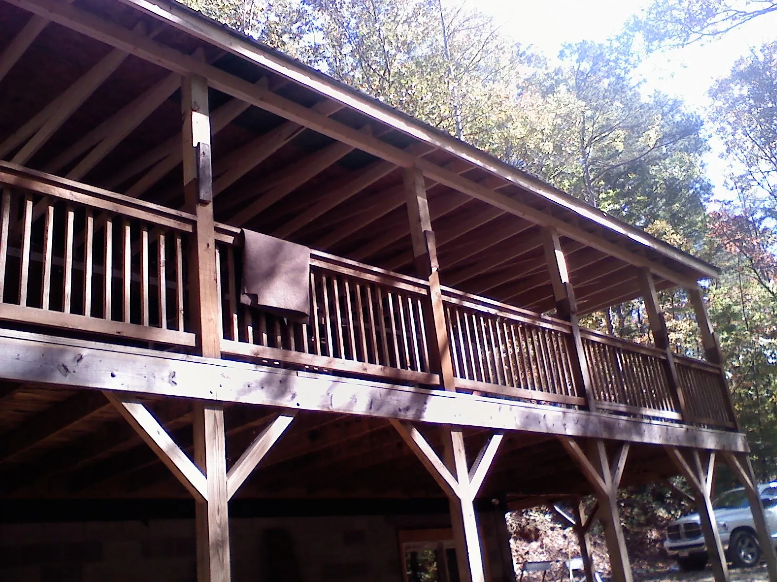 Timber framing under a new elevated porch and deck — Roof Leak Repair in Gable by Roofing Brothers